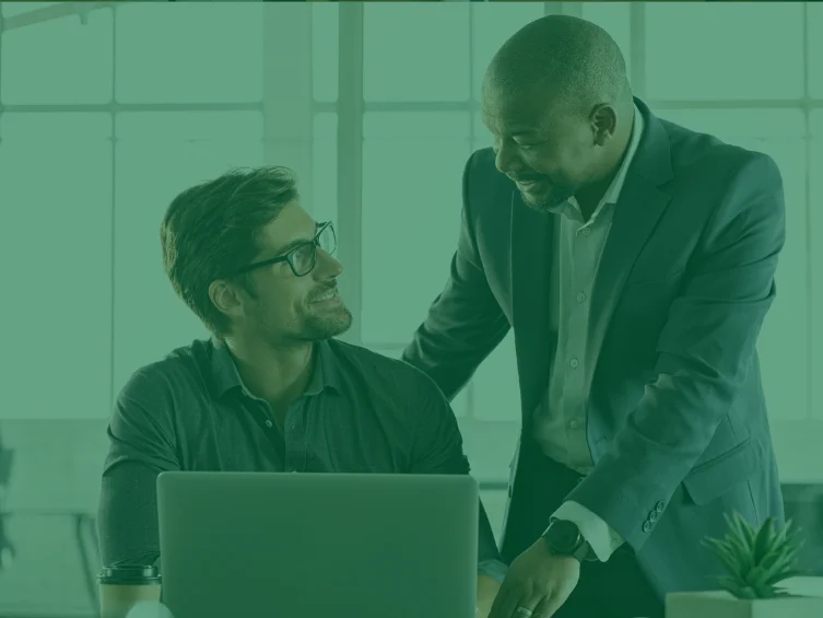 young male professional talks at a meeting